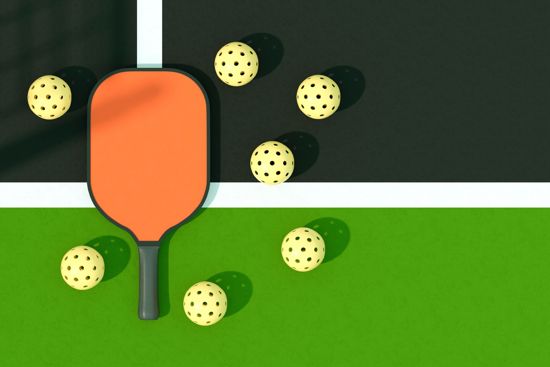 Pickleball racket and balls on court with net shadow